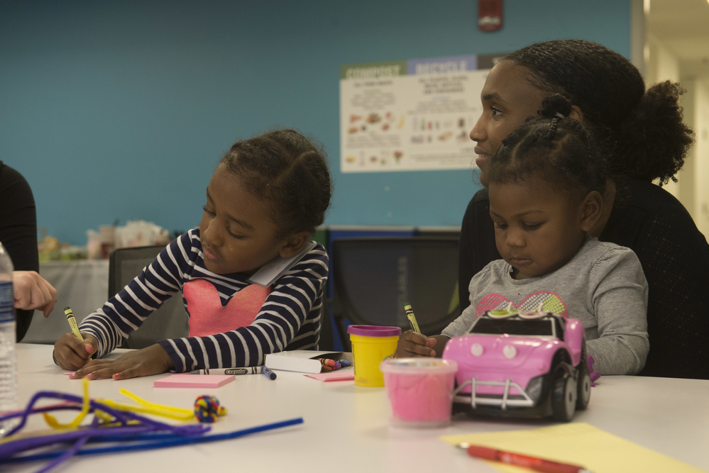 Mother and two children at a table